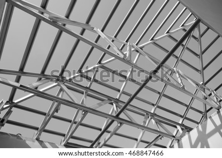 Black and white photo,Structure of steel roof frame for building construction.The advantage of this structure is lightweight but strong.
