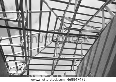 Black and white photo,Structure of steel roof frame for building construction.The advantage of this structure is lightweight but strong.