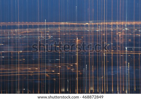 Abstract image of night lights in the city with motion blur.