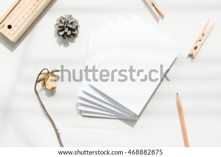 Top view of blank  white notebooks with  gadget on white background.