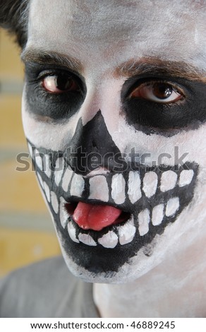 close-up portrait of a creepy skeleton guy perfect for Carnival (brick wall background)