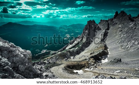 Vision of the rocky mountains at the underwater planet. This picture was taken in Italian Dolomites, where two completely different types of landscapes are contrasting.
