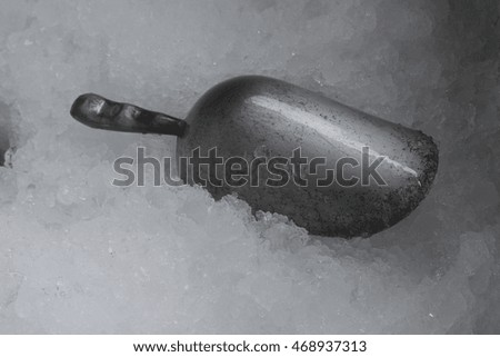 cool ice spoon in ice frozen
