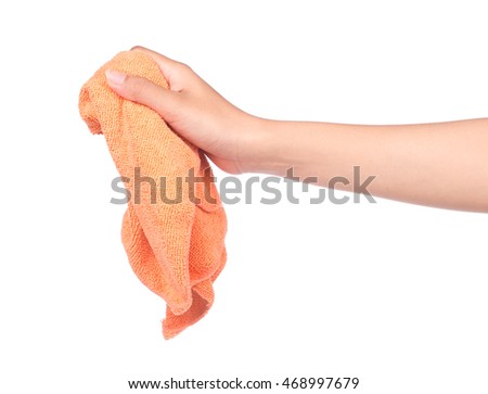 hand holding orange and green towel rolls isolated on white background.