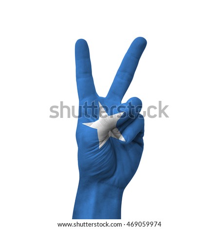 Hand making victory sign, somalia painted with flag as symbol of victory, win, success - isolated on white background