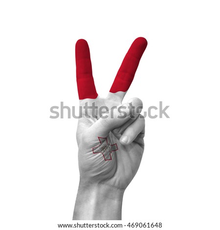 Hand making victory sign, malta painted with flag as symbol of victory, win, success - isolated on white background