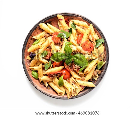 pasta with meat and basil on a plate on a white background Royalty-Free Stock Photo #469081076