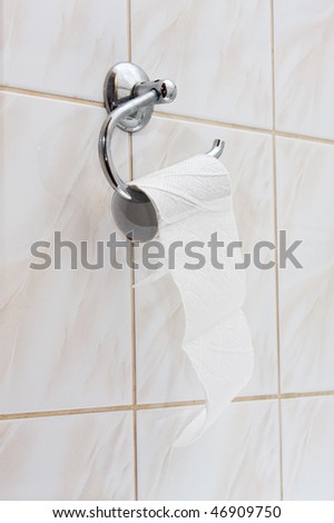 An almost empty roll of toilet paper Royalty-Free Stock Photo #46909750