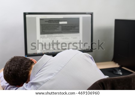 male worker fall asleep during filling taxes - stock photo