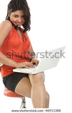 Young Woman Using Laptop. Isolated over white