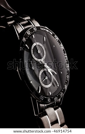 close-up od a wristwatch on a black Royalty-Free Stock Photo #46914754