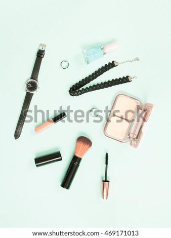 Top view of girl accessories on blue background. Flat lay.
