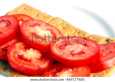 white pieces of fresh tomatoes and toast bread