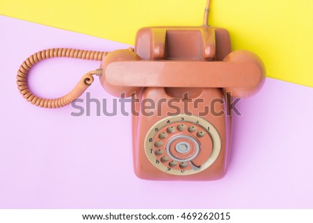  flat lay Vintage telephone  on pastel color background