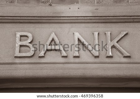 Bank Sign on Building Facade in Black and White Sepia Tone