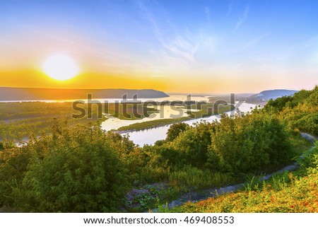 Magnificent aerial panoramic view on the touristic part of the Volga river near Samara city at sunset. Beautiful natural landscape of the Central part of Russia at summer. Europe.
