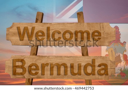 Welcome to  Bermuda sing on wood background with blending national flag