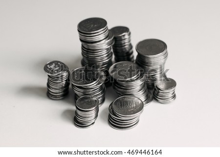 Ukrainian silver coins. A stack of coins on white background. Pyramid of money.