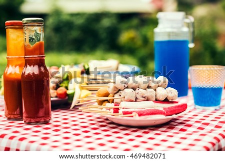Close up barbecue table with blurry nature background vintage picture.