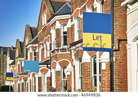 Typical English home with a "Let" and "For Sale" sign.