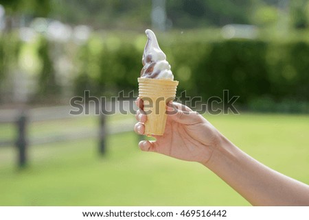 Close up of two tone ice cream in hand.