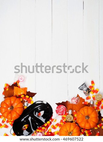 Autumn: Halloween Mask And Candies Background