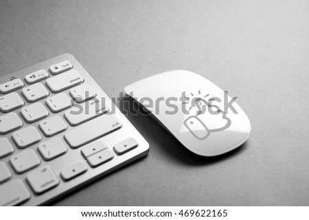 Social media icon on mouse & computer keyboard 