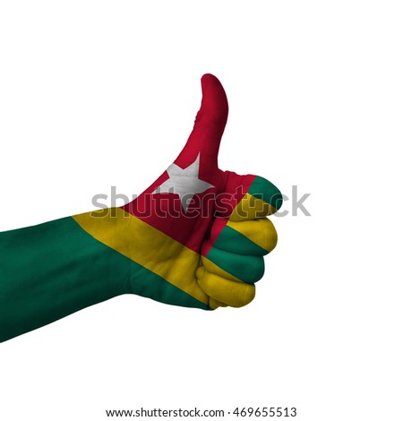 Hand making thumbs up sign, togo painted with flag as symbol of thumbs up, like, okay, positive  - isolated on white background