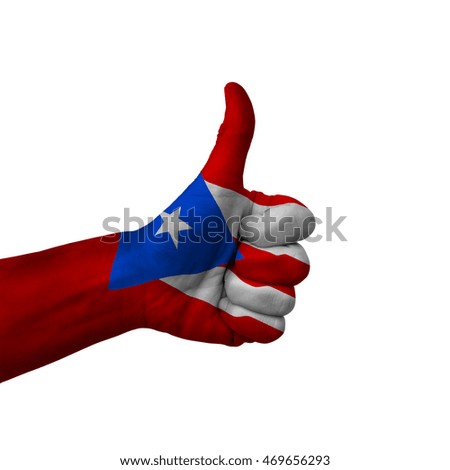 Hand making thumbs up sign, puerto rico painted with flag as symbol of thumbs up, like, okay, positive  - isolated on white background