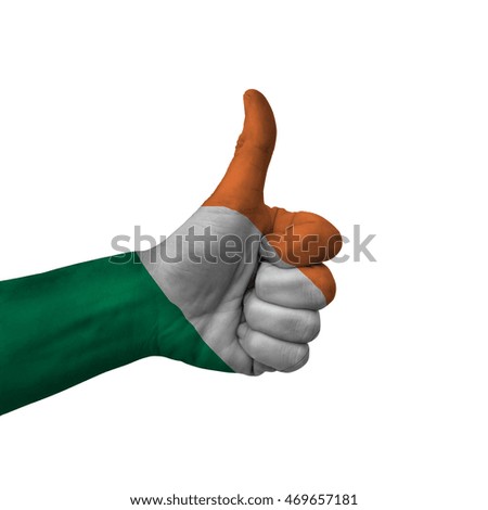 Hand making thumbs up sign, ireland painted with flag as symbol of thumbs up, like, okay, positive  - isolated on white background