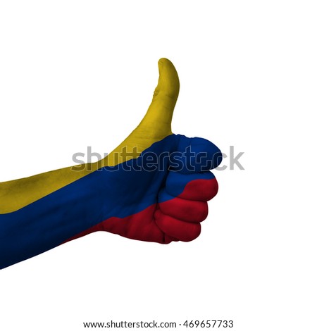 Hand making thumbs up sign, colombia painted with flag as symbol of thumbs up, like, okay, positive  - isolated on white background