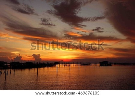 Lake view on sunset time at Thailand,colorful cloud with sky and water reflect  at lake,select focus with shallow depth of field:ideal use for background.