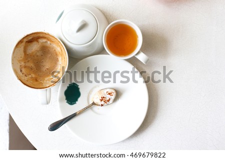 Empty Capucino art coffee on white table.