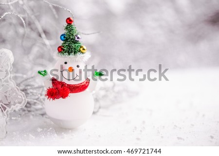 Snowman on snow and flowers background , Soft & Dreamy Effect, Low Clarity