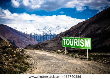 Pointer on mountain road in Tajikistan. Pamir highway. Toned.