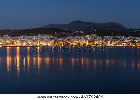 Rethymno, Crete, Greece: downtown at summer night. Panoramic view from the Mediterranean sea.