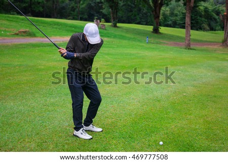 Male golf player in Golf court is Surrounded  natural