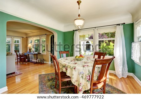 Traditional dining area with wooden table set. Open floor plan. Northwest, USA