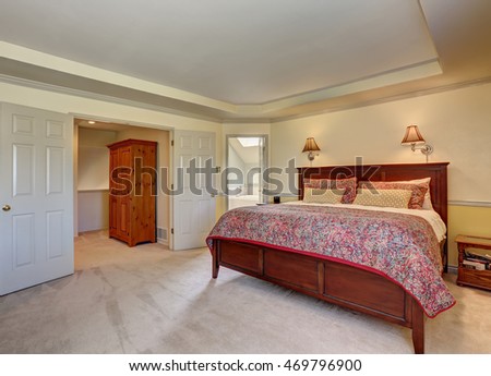 Bedroom interior with deep brown furniture and carpet floor. Northwest, USA