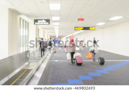 Blurred traveler at airport terminal blur background.