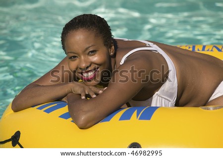 Woman Relaxing on Pool Float