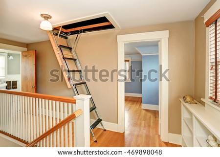Hallway interior with folding attic ladder. Northwest, USA  Royalty-Free Stock Photo #469898048