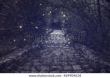 Abstract and mysterious background of old witch castle gate. Filtered image. Glitter overlay. Halloween concept