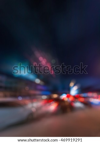 vintage tone blur image of car on street with firework in background night time.(vertical)