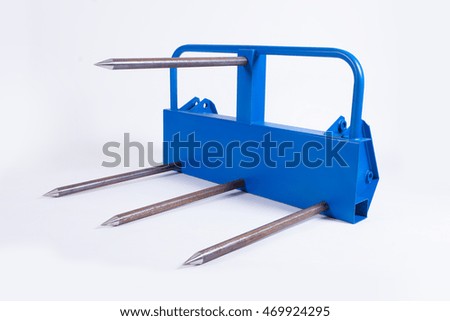 Pitchfork for a tractor, collecting hay for a rural hozyaysv