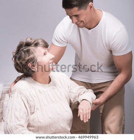 Picture of a senior woman and a young man