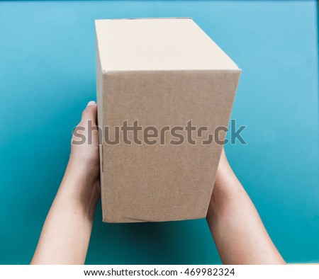 Hand holding a box