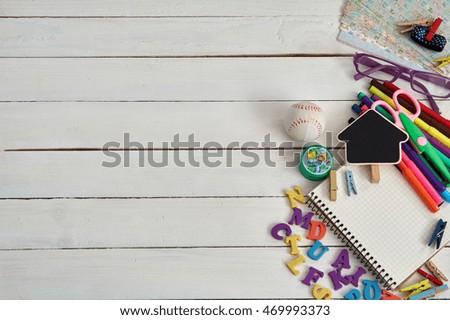 School preparations.Colorful school supplies on rustic wooden background with copy space