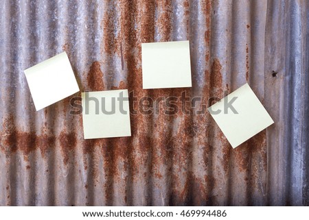 white paper on grunge metal fence