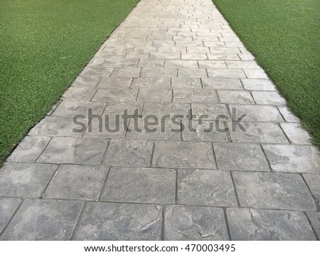 Long concrete footpath in the Grass